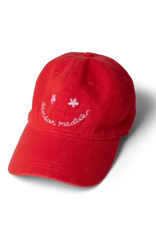 washed smiley cap in red with pink embroidery sold by Damson Madder