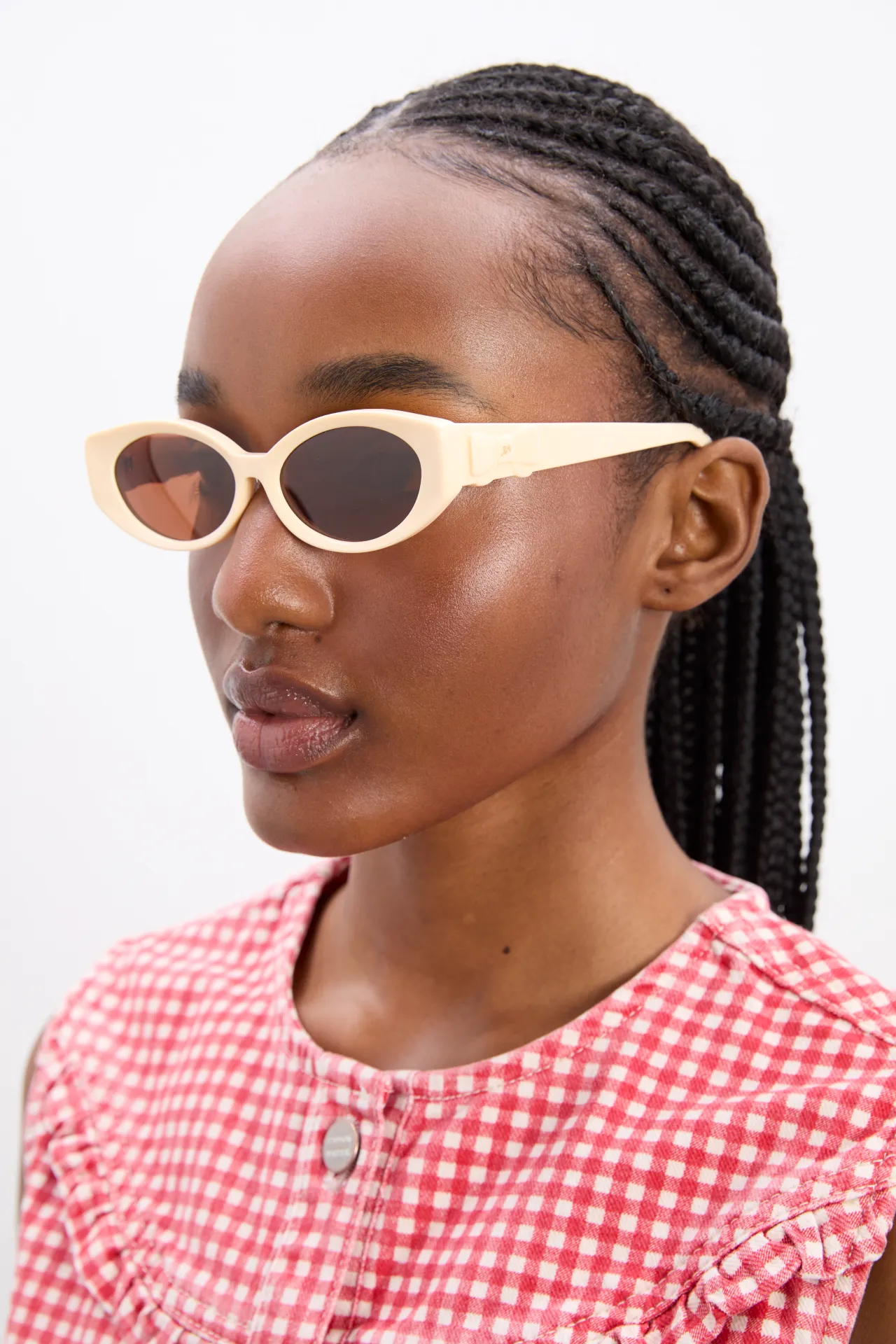 catty oval sunglasses with bow detail in bone sold by Damson Madder