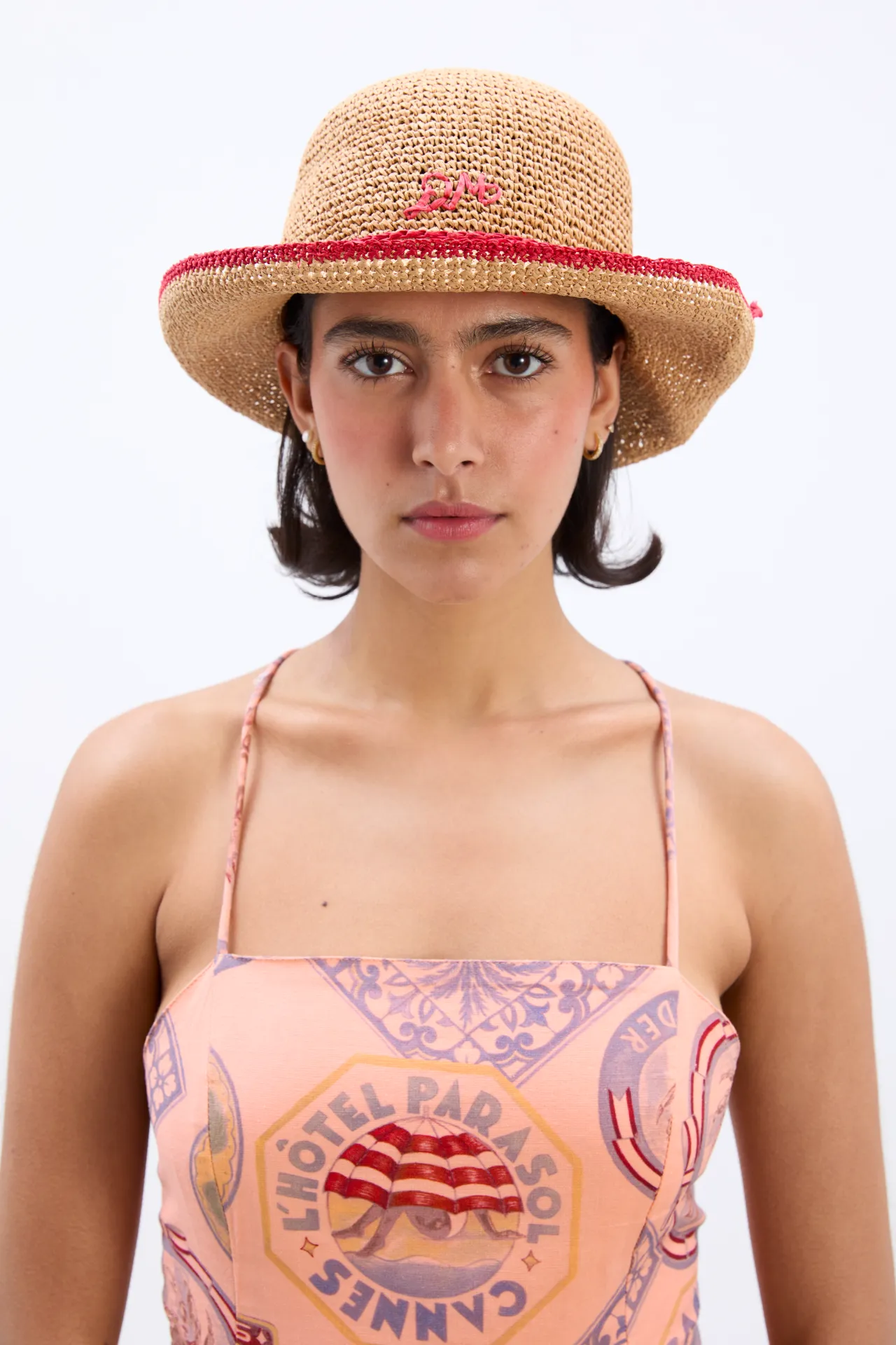 roll back raffia hat with red bow detail sold by Damson Madder