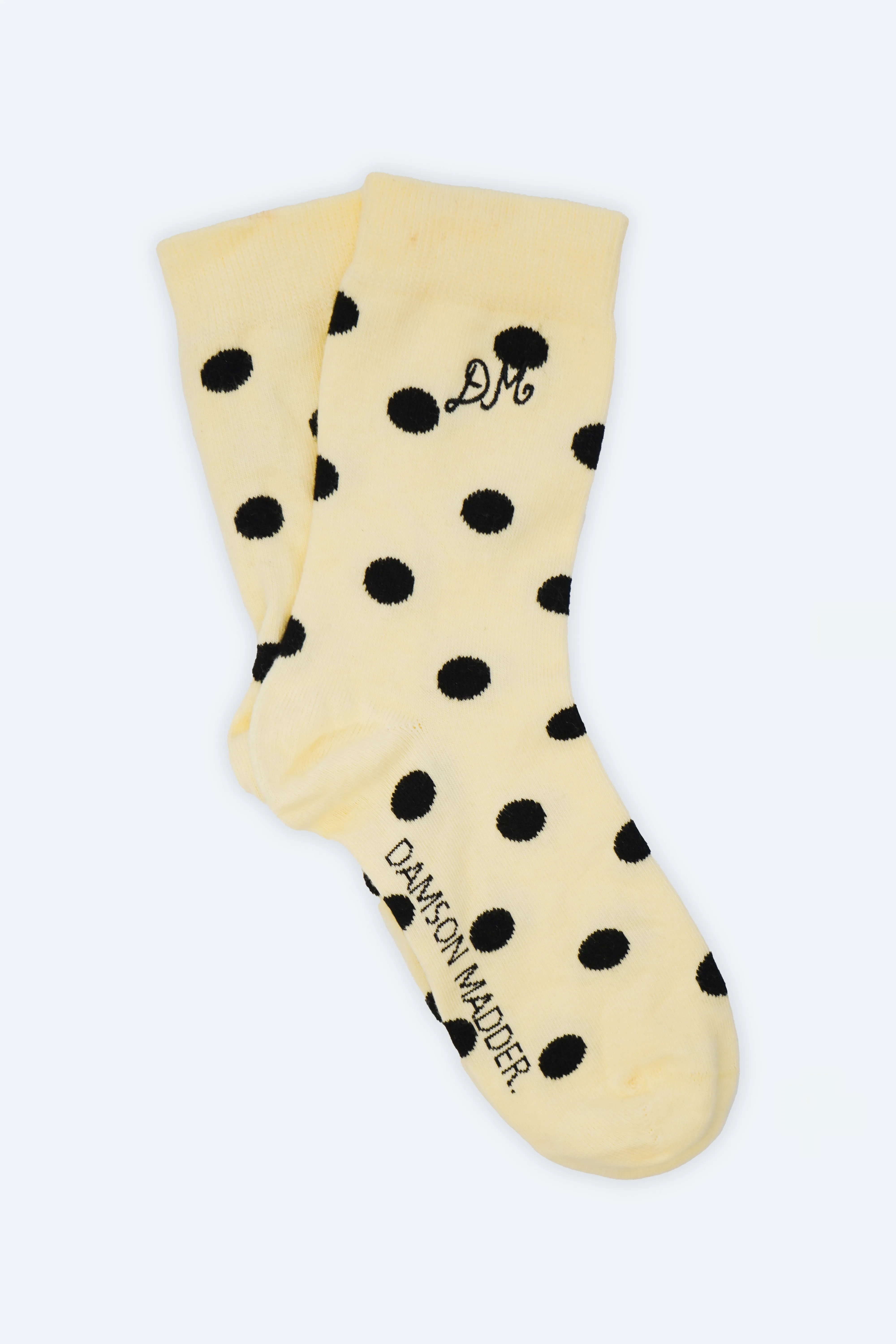 calf length polkadot socks butter/black sold by Damson Madder