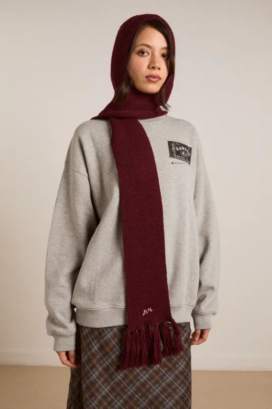 tassel hooded scarf in burg sold by Damson Madder
