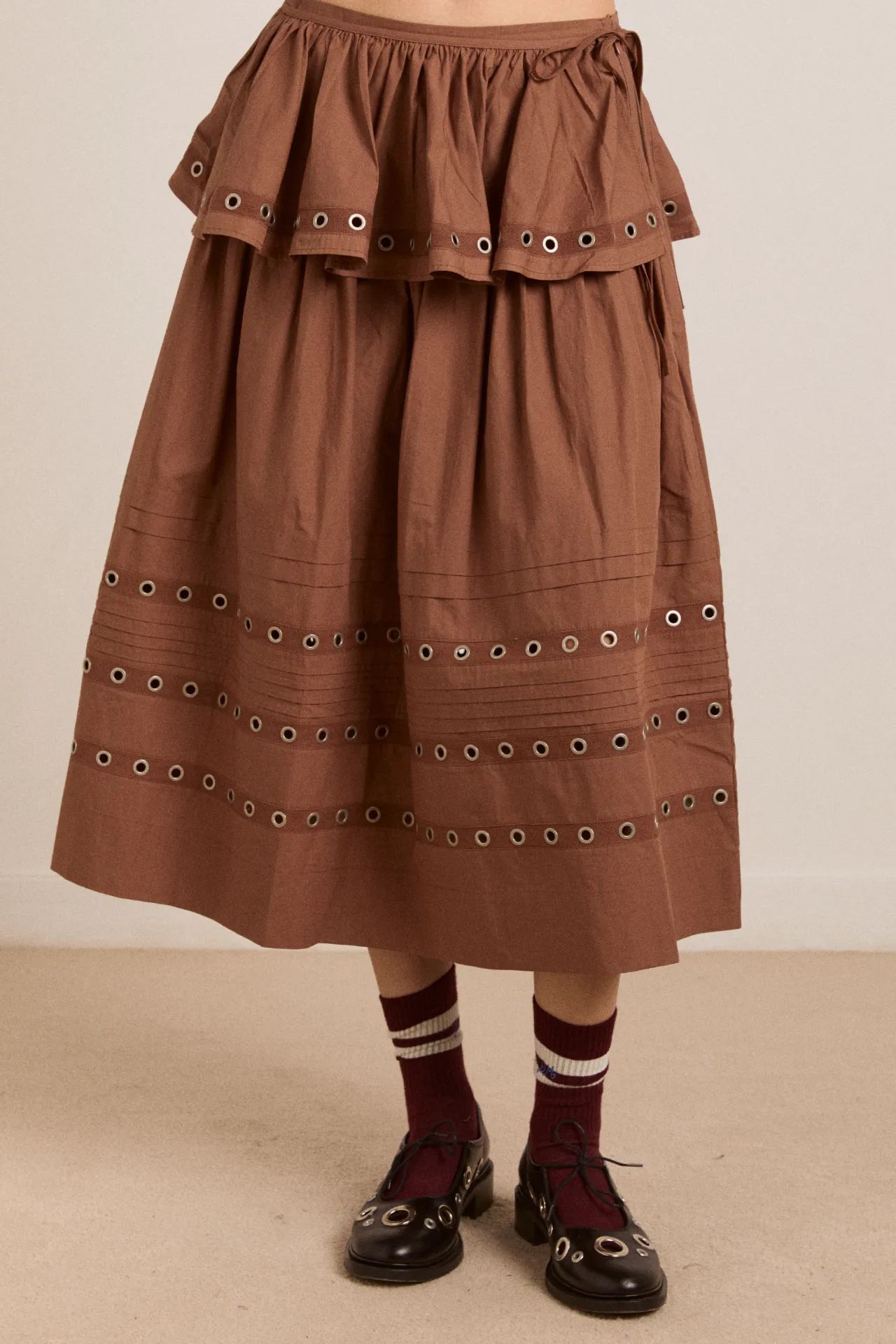 anika eyelet skirt with ruffle belt- tan sold by Damson Madder