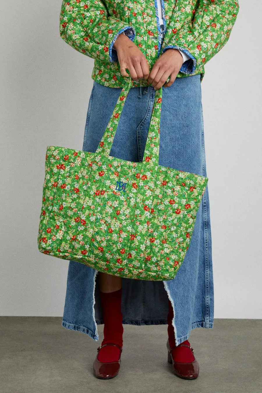 padded tote in reversible floral sold by Damson Madder