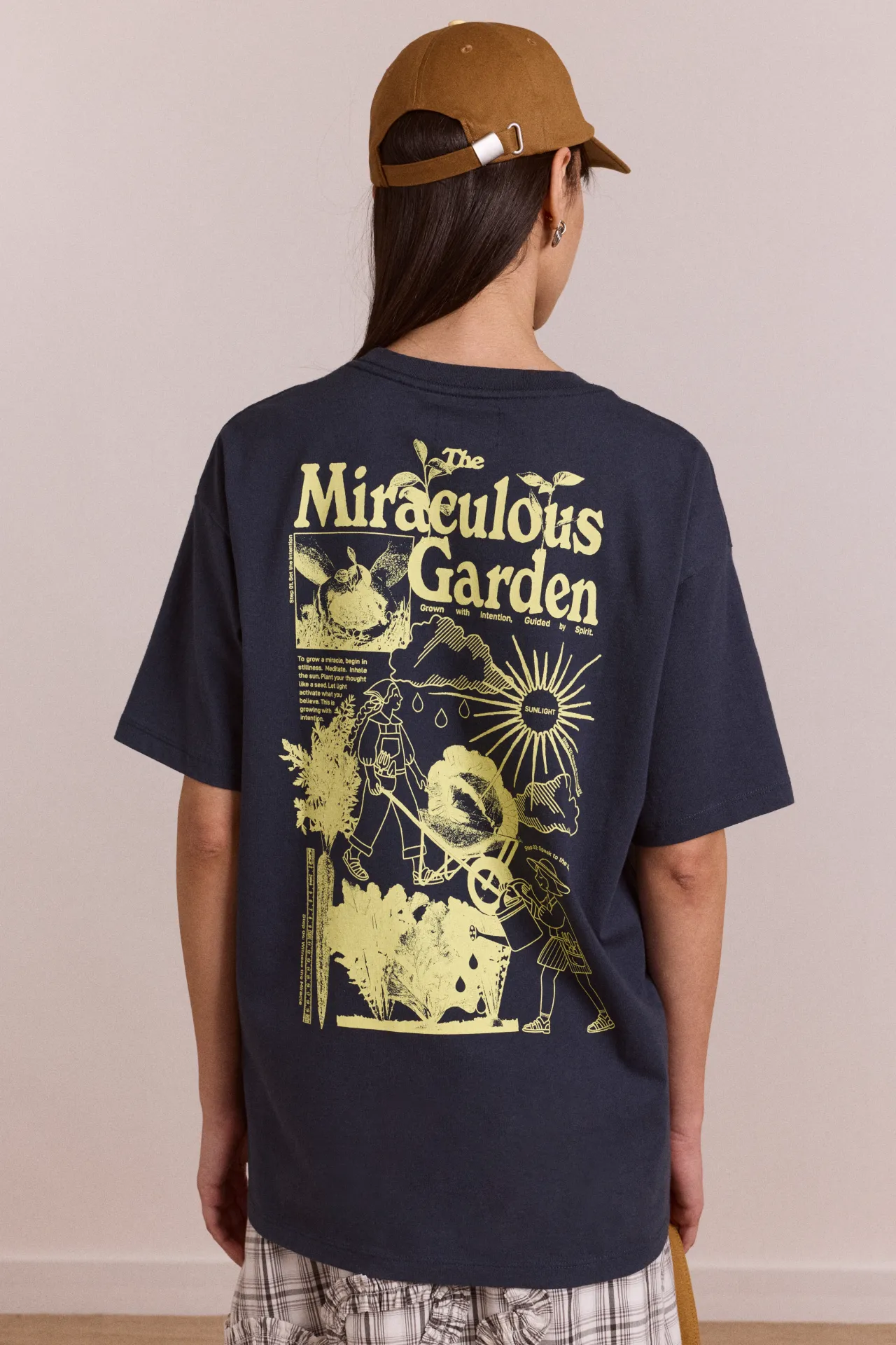 miraculous garden - navy t-shirt sold by Damson Madder