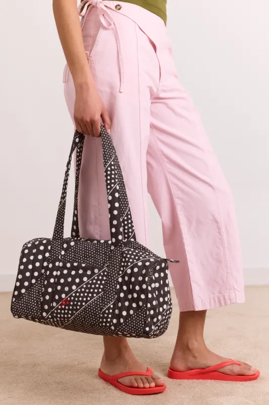 quilted weekender bag - washed black spot stripe print made by Damson Madder