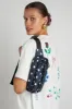 printed spot frill front cross body bag sold by Damson Madder