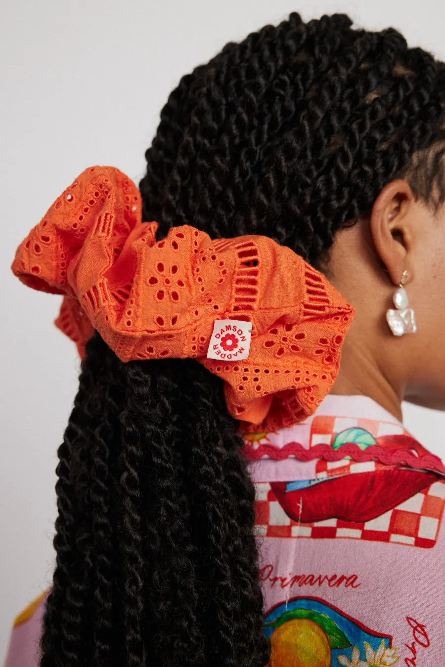 oversized broderie scrunchie in orange sold by Damson Madder