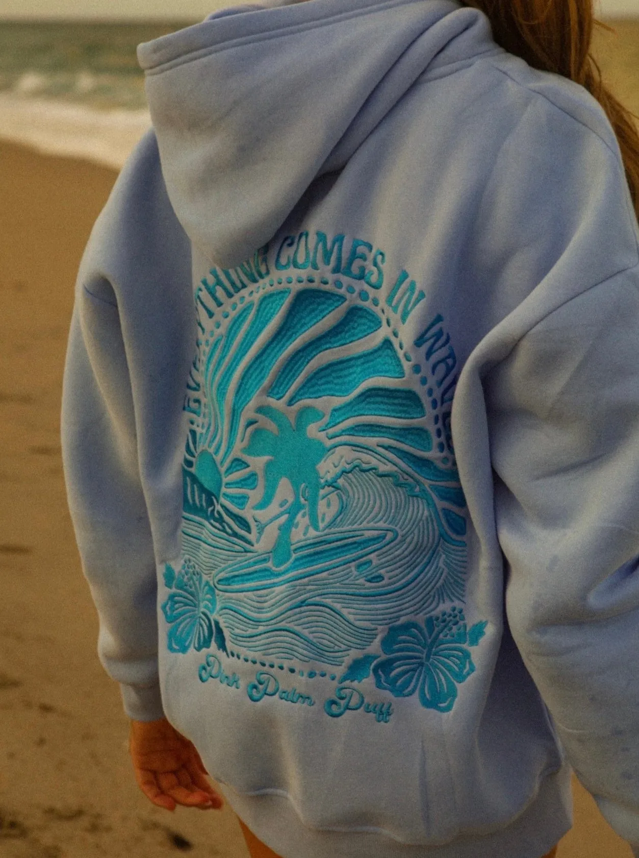 "Everything Comes in Waves” Hoodie in Blue sold by Pink Palm Puff
