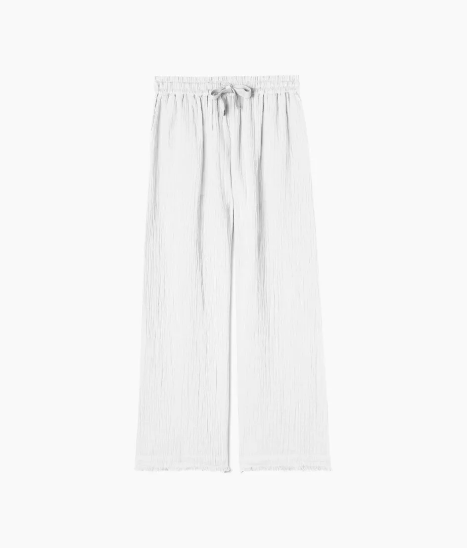 The Going Places Gauze Frayed Hem Pant - White Sand sold by Summersalt