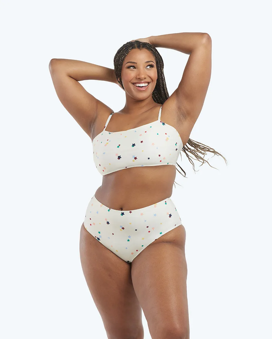 The High Leg High Rise Bottom - Small Scatter Stars in White Sand sold by Summersalt