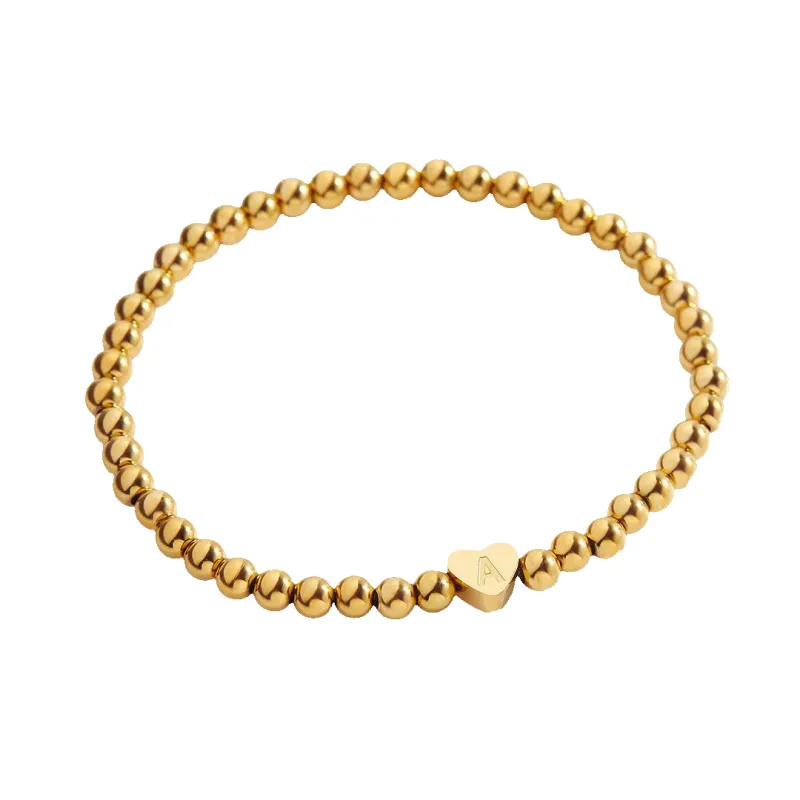 Gold Beaded Bracelet with Heart Initial sold by Mint & Lilly