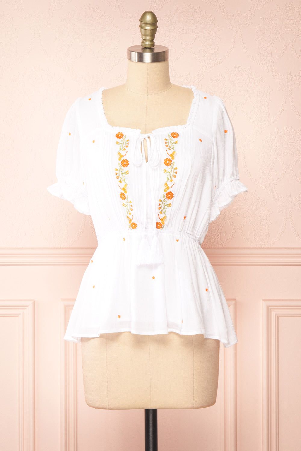 Elden | White Peplum Top w/ Floral Embroidery sold by Boutique 1861