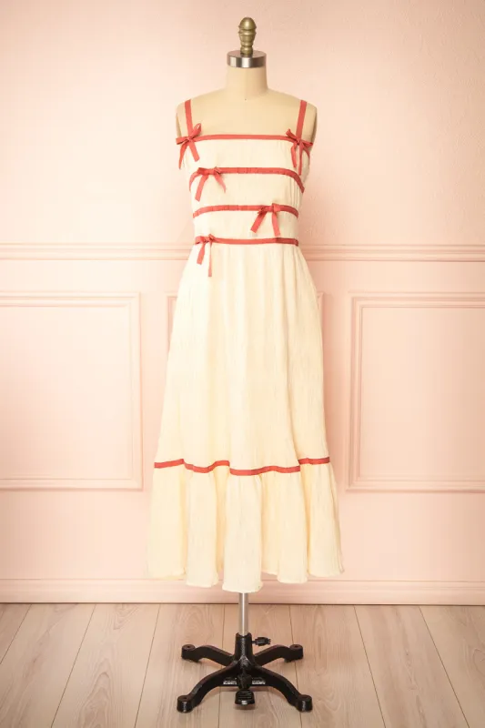 Dixie Beige | Pleated Midi Dress w/ Pink Bows sold by Boutique 1861