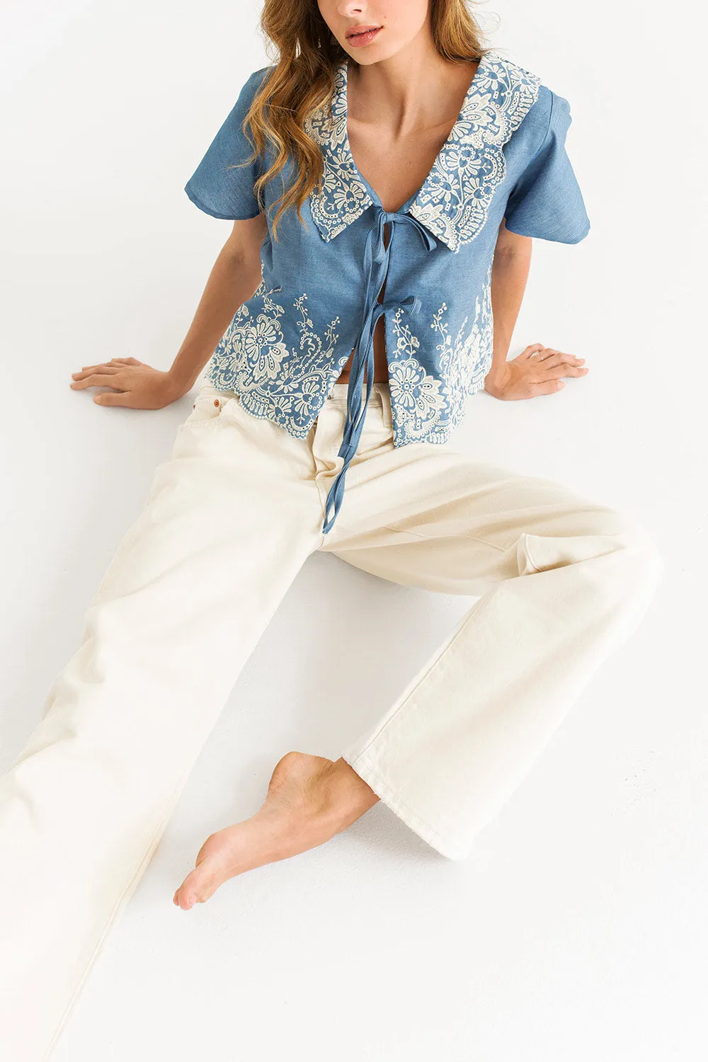 Meryl Blue | Denim Blouse w/ Floral embroidery & Tied Bows sold by Boutique 1861