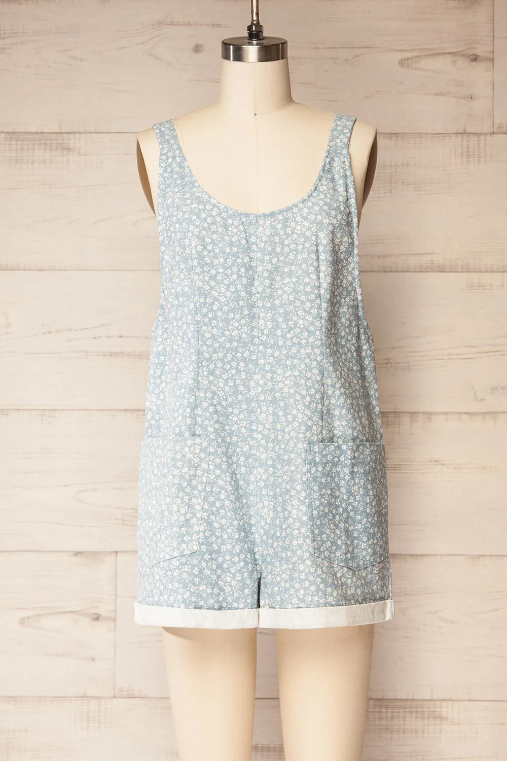 Douala | Blue Denim Romper with White Floral Prints and Pockets sold by Boutique 1861