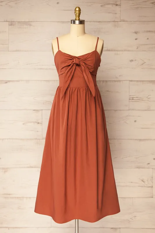 Daloa | Rust Midi Dress with Bow Detailing and Pockets sold by Boutique 1861