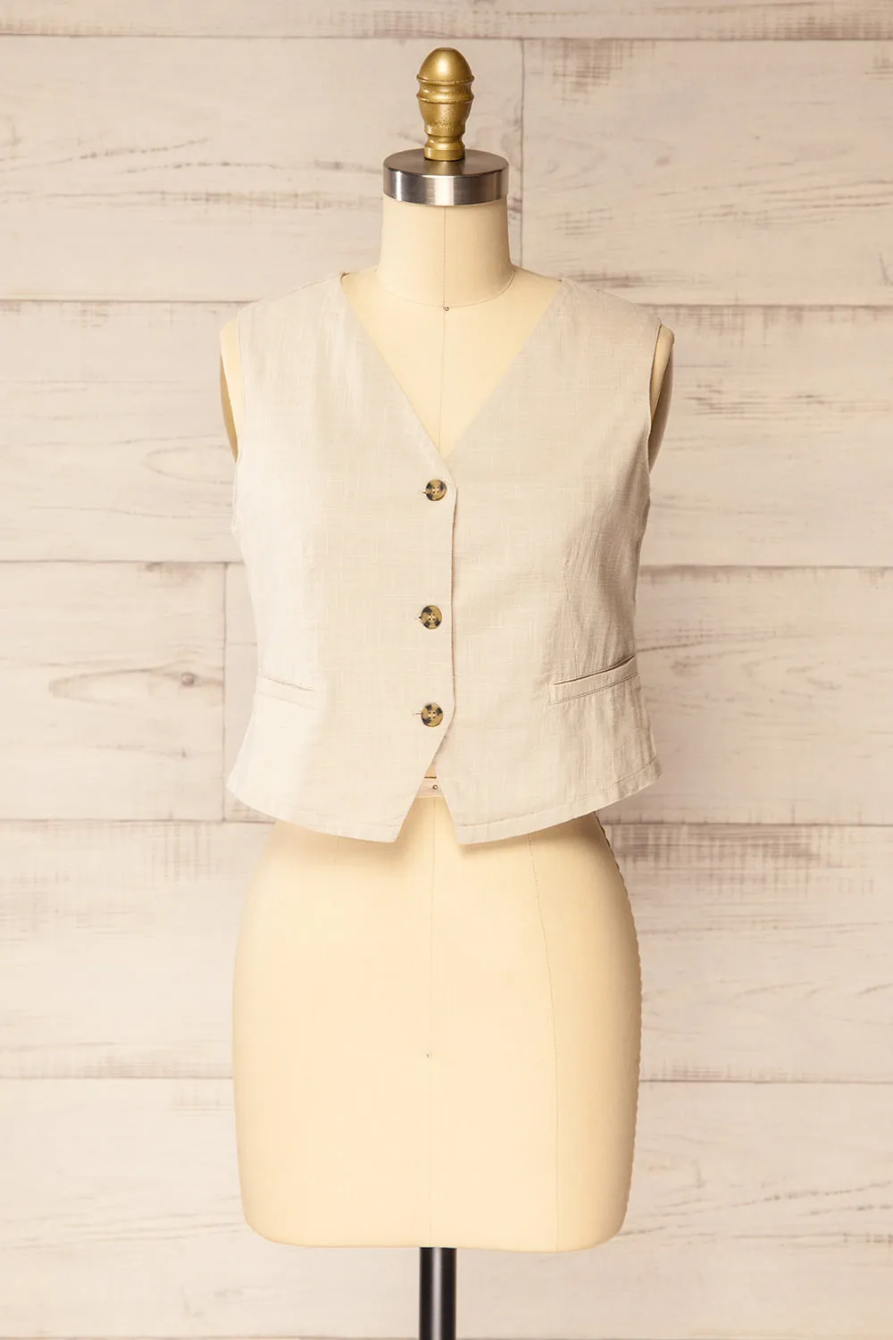 Deng Beige | Sleeveless Tailored Vest with Marbled Buttons sold by Boutique 1861