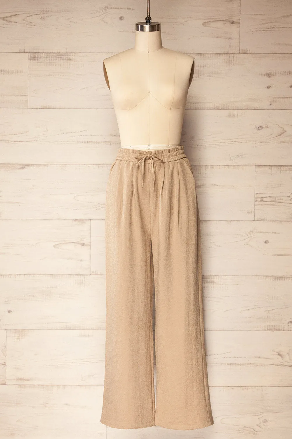 Cabot | Beige Loose-Fitted Pants with Elastic Waistband sold by Boutique 1861