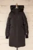 Mikaila Black | Knee-length Quilted Down Jacket sold by Boutique 1861