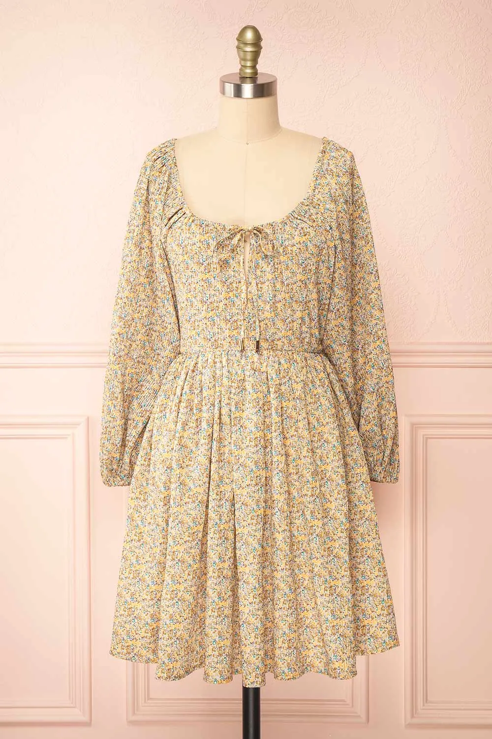 Jyna | Short Floral Pleated Dress with Open Back sold by Boutique 1861