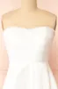 Stefany | White High-Low Dress w/ Pearls sold by Boutique 1861