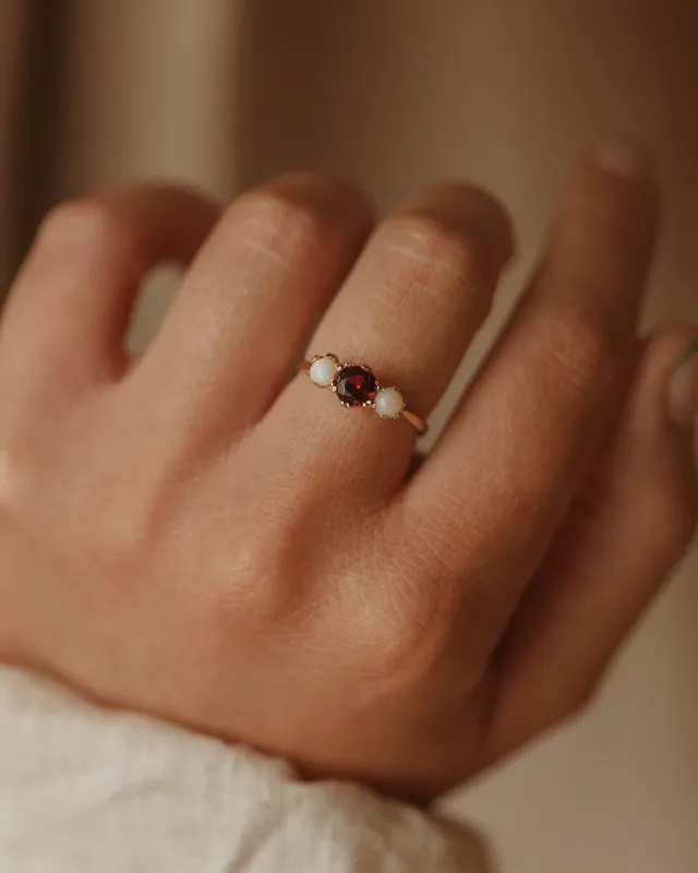 Iris 1969 9ct Gold Garnet & Opal Trilogy Ring sold by Rock n Rose