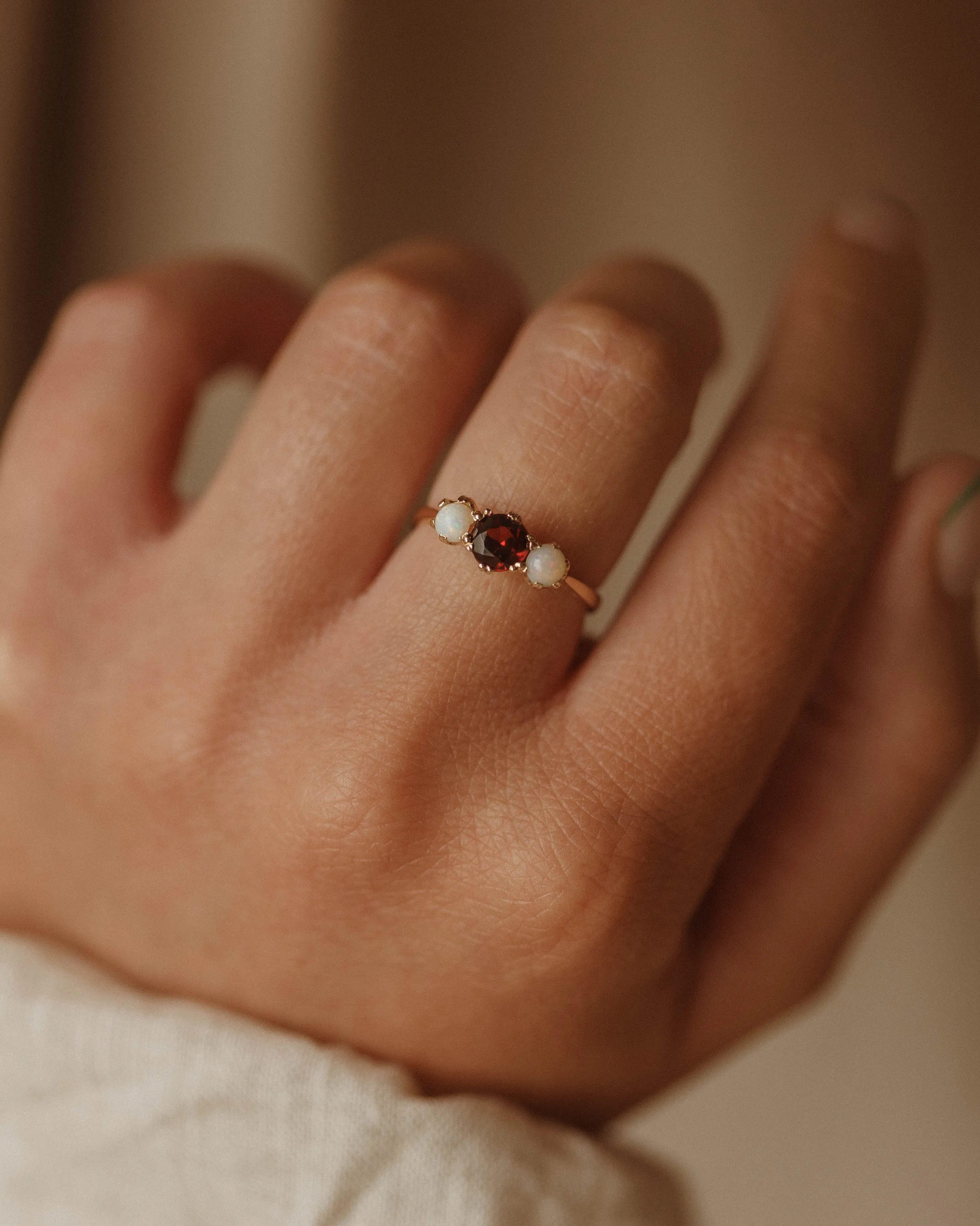 Iris 1969 9ct Gold Garnet & Opal Trilogy Ring sold by Rock n Rose