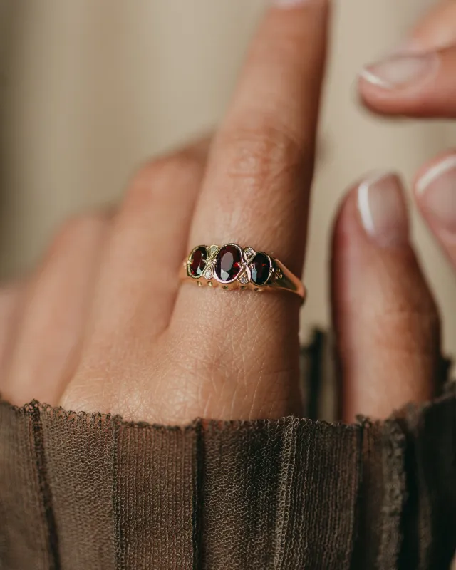Winona 1989 Vintage 9ct Gold Garnet & Diamond Trilogy Ring sold by Rock n Rose