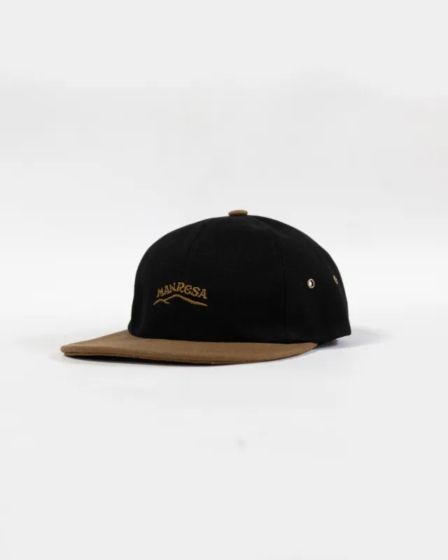 The Nor'easter Cap in Black/Carmel sold by Manresa