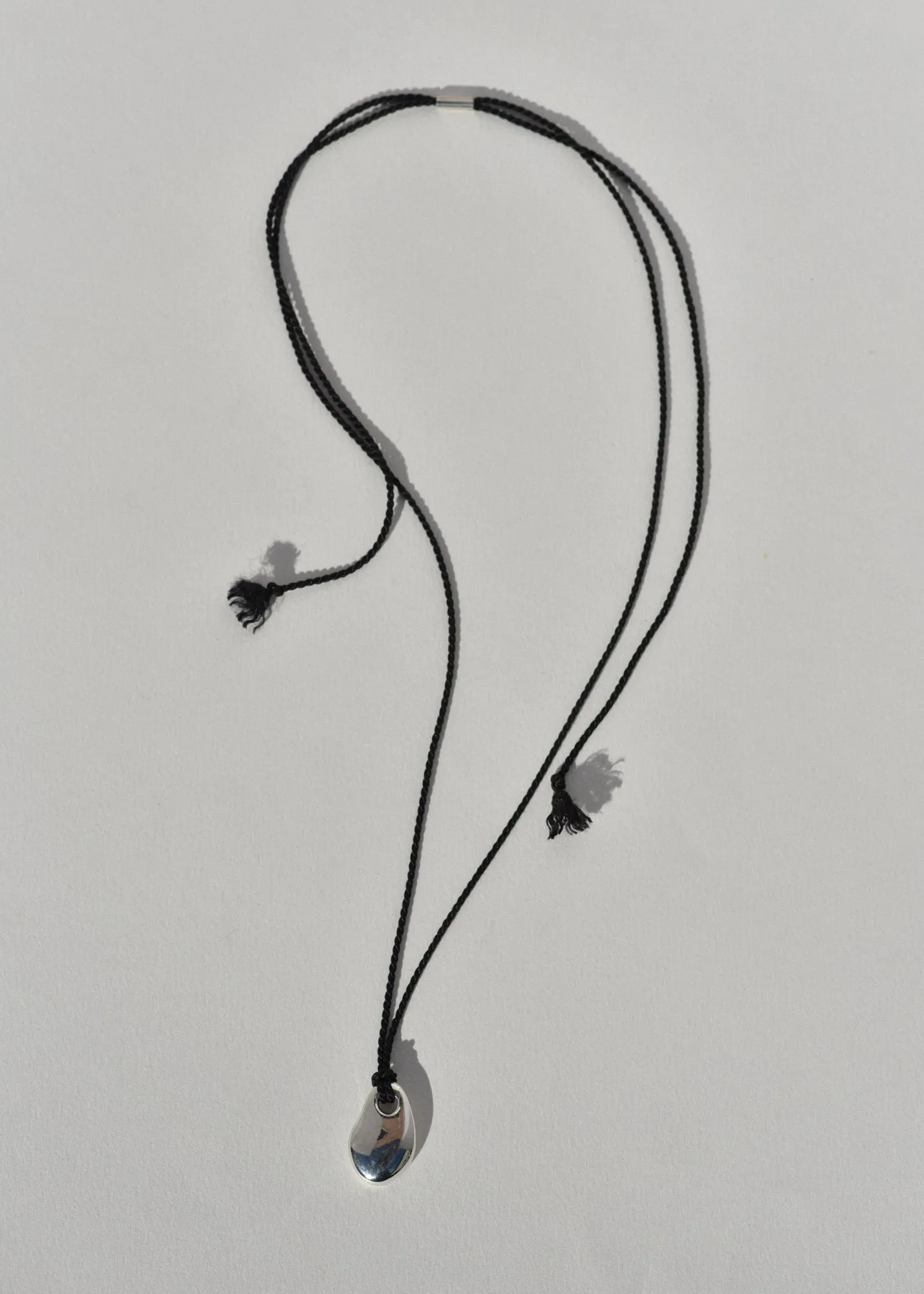 Sea Stone Pendant on Silk Cord sold by Leigh Miller