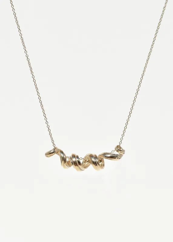 Gold Corkscrew Pendant sold by Leigh Miller