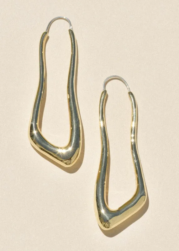Brass Lanky Hoops sold by Leigh Miller