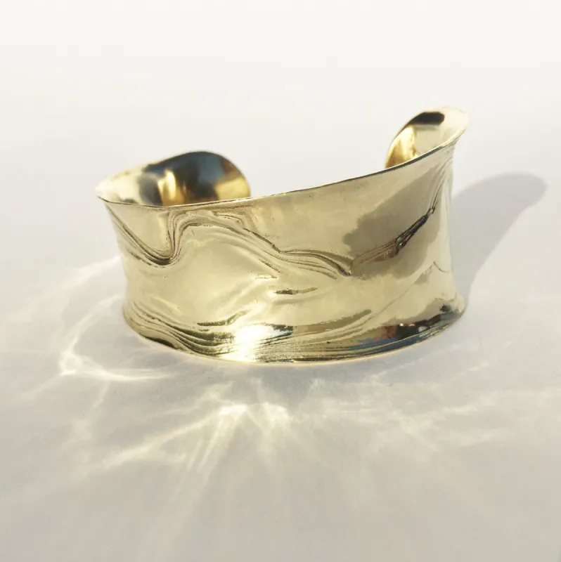 Brass Anticlast Cuff sold by Leigh Miller