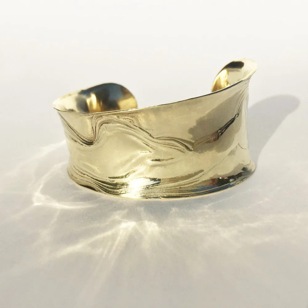 Brass Anticlast Cuff sold by Leigh Miller
