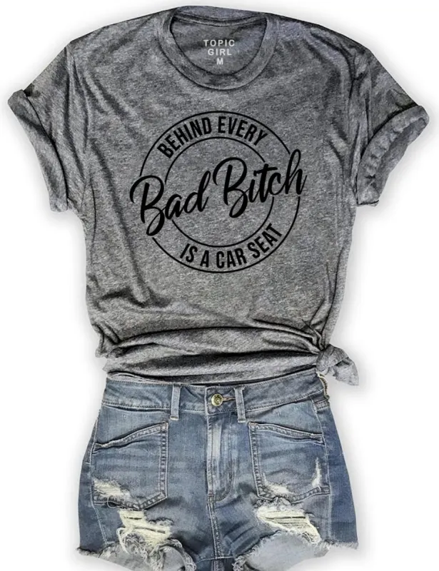 Behind Every Bad Bitch Is A Car Seat Tee sold by Topic Girl