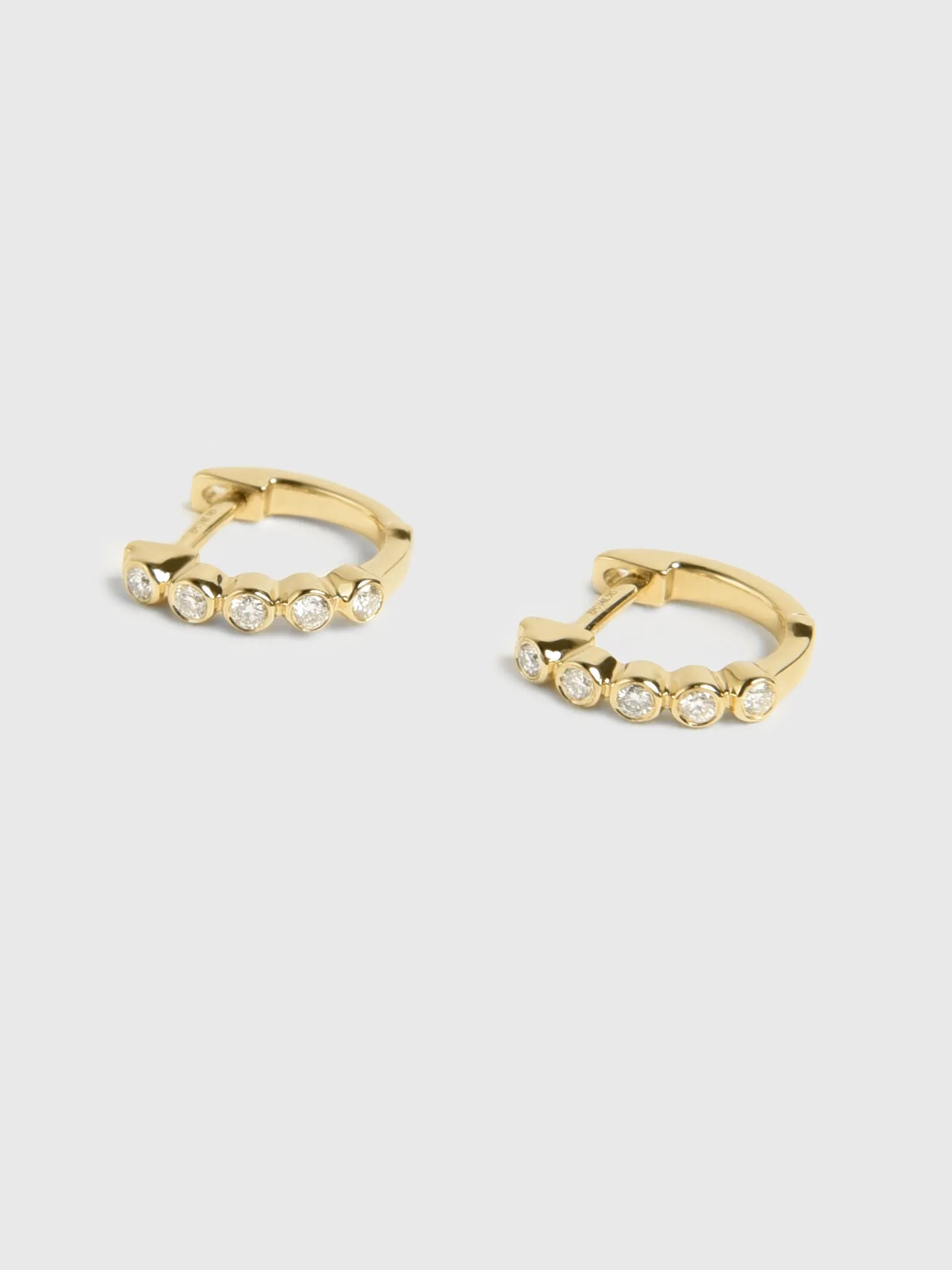 EF Collection Diamond Bezel Mini Huggie Earrings sold by Saint Bernard