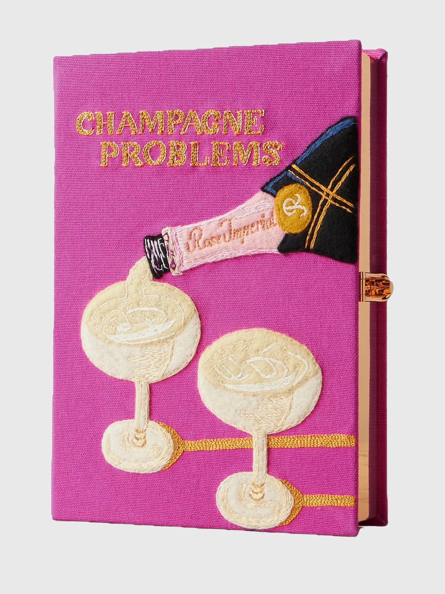 Olympia Le-Tan Champagne Problems Book Clutch sold by Saint Bernard