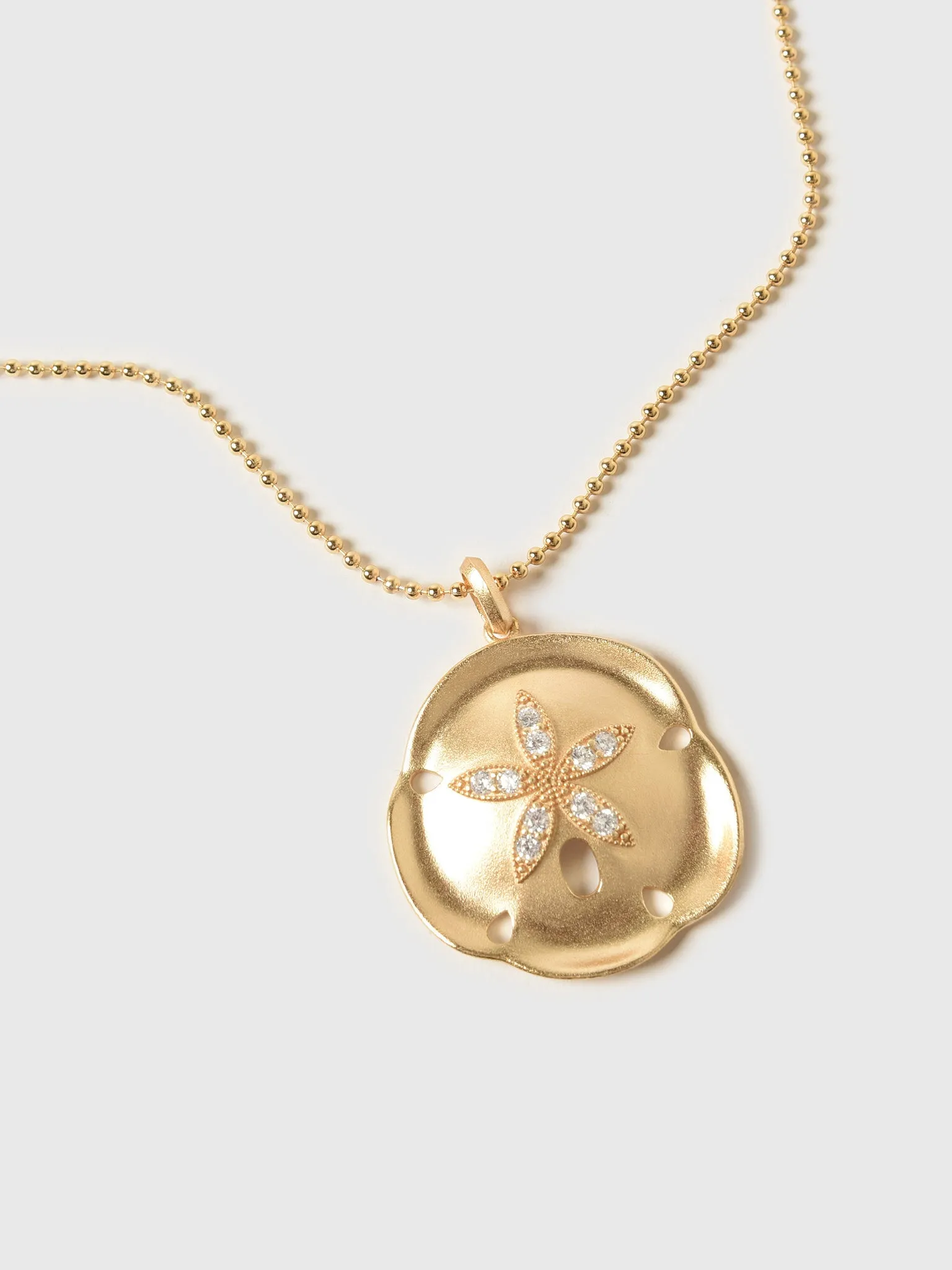 Joy Dravecky Donna Sand Dollar Necklace sold by Saint Bernard