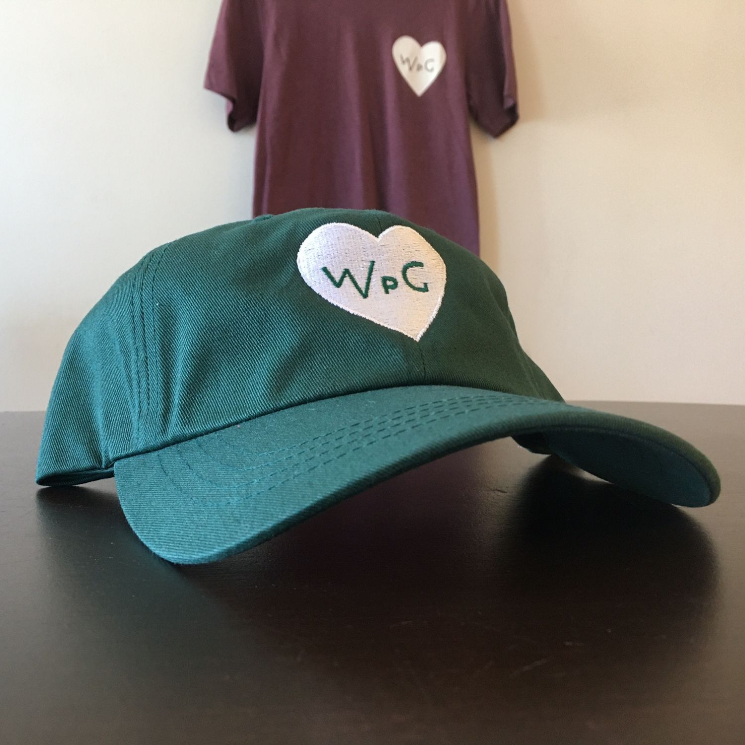 WPG Heart Dad Hat | White on Forest sold by We Heart Winnipeg