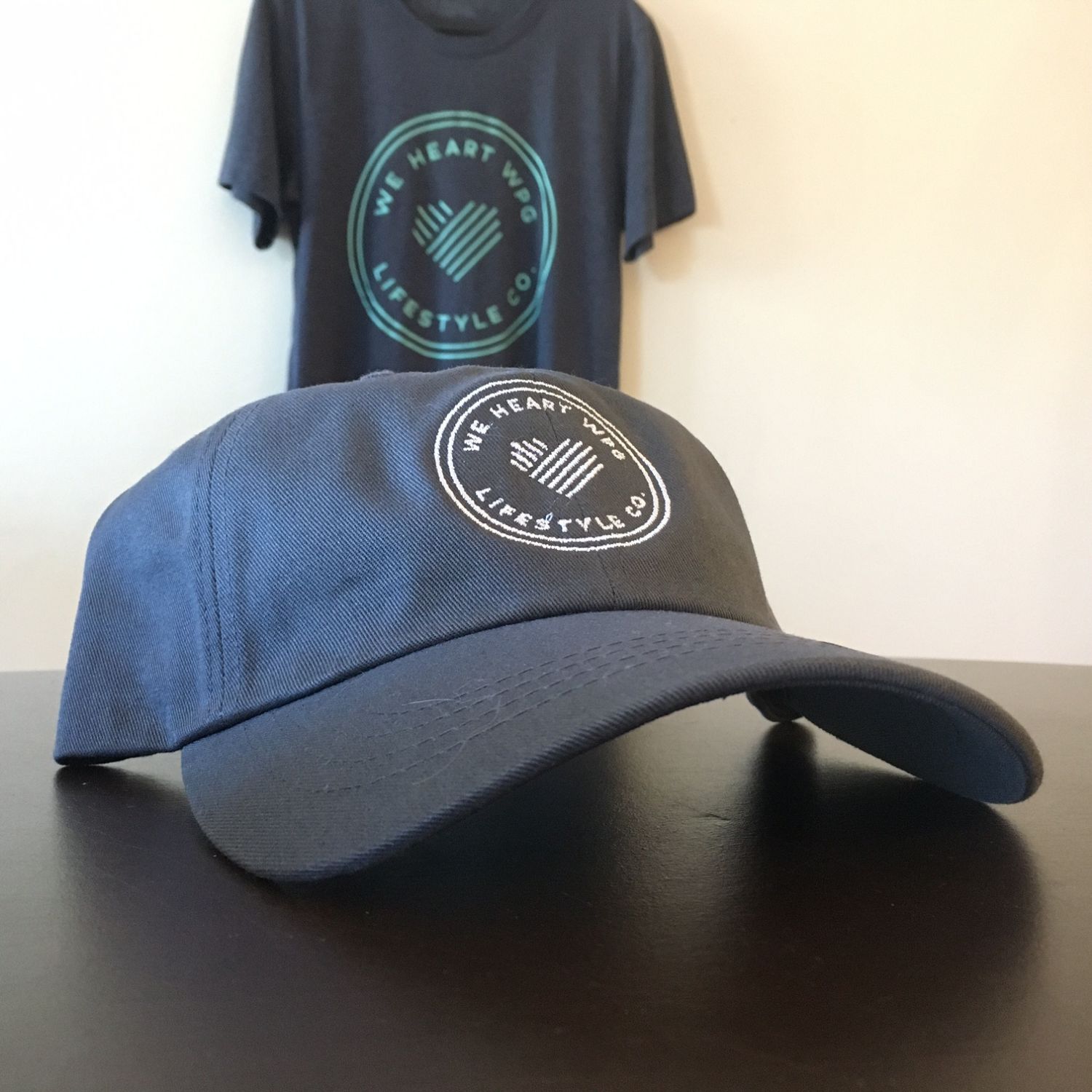 WHW Lifestyle Dad Hat | White on Charcoal sold by We Heart Winnipeg