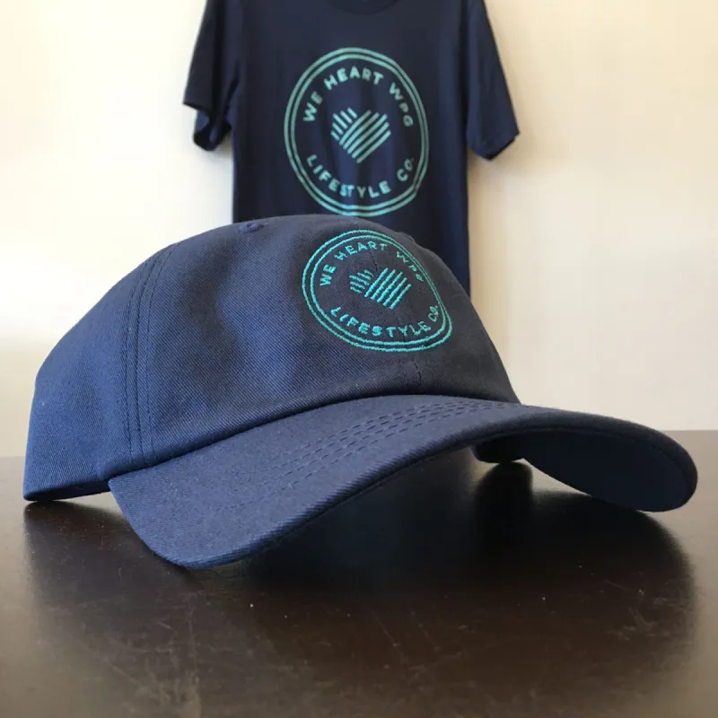 WHW Lifestyle Dad Hat | Teal on Navy sold by We Heart Winnipeg