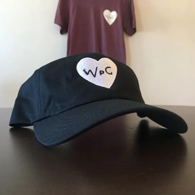 WPG Heart Dad Hat | White on Black sold by We Heart Winnipeg