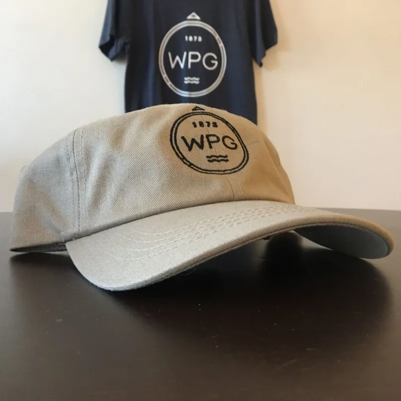 WPG Compass Dad Hat | Black on Tan sold by We Heart Winnipeg