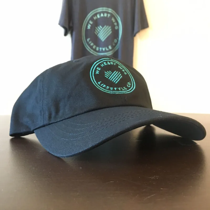 WHW Lifestyle Dad Hat | Teal on Black sold by We Heart Winnipeg