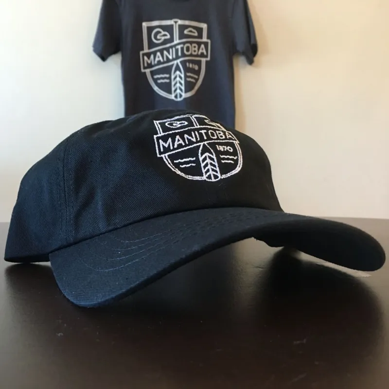 MB Cottage Dad Hat | White on Black sold by We Heart Winnipeg