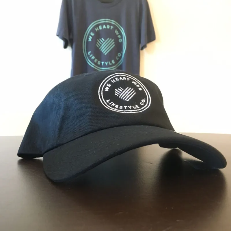 WHW Lifestyle Dad Hat | White on Black sold by We Heart Winnipeg