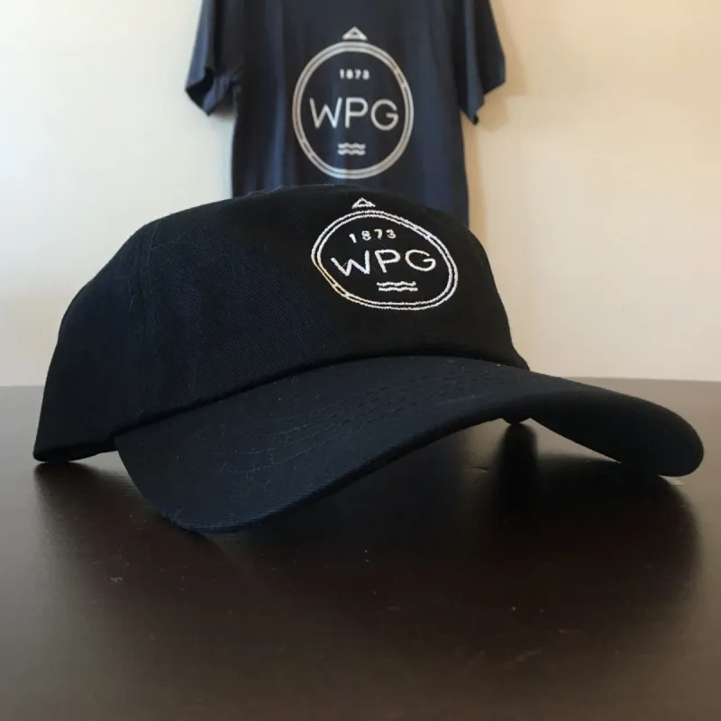 WPG Compass Dad Hat | White on Black sold by We Heart Winnipeg