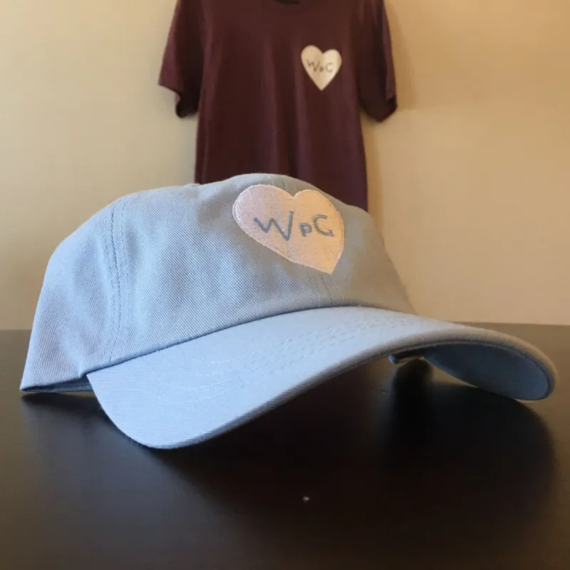 WPG Heart Dad Hat | White on Powder Blue sold by We Heart Winnipeg
