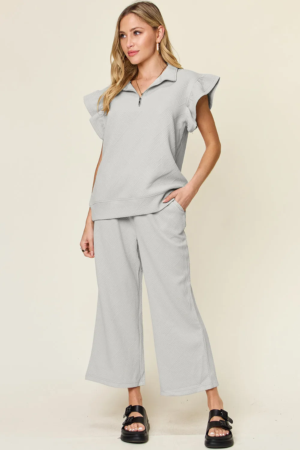 Double Take Texture Ruffle Short Sleeve Top and Drawstring Wide Leg Pants Set sold by The Dogwood Boutique