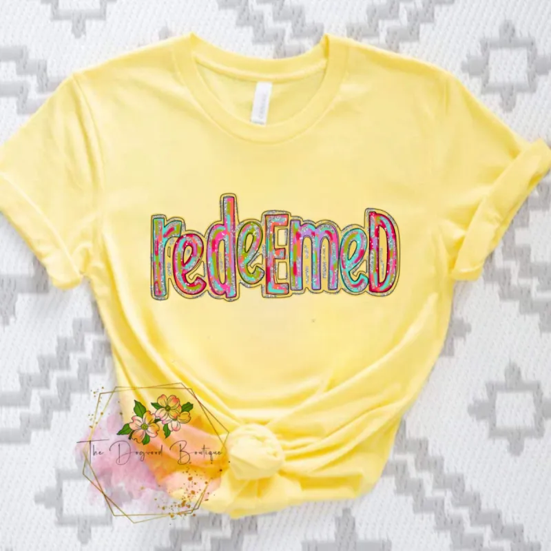 Redeemed Silver Colorful Tee sold by The Dogwood Boutique